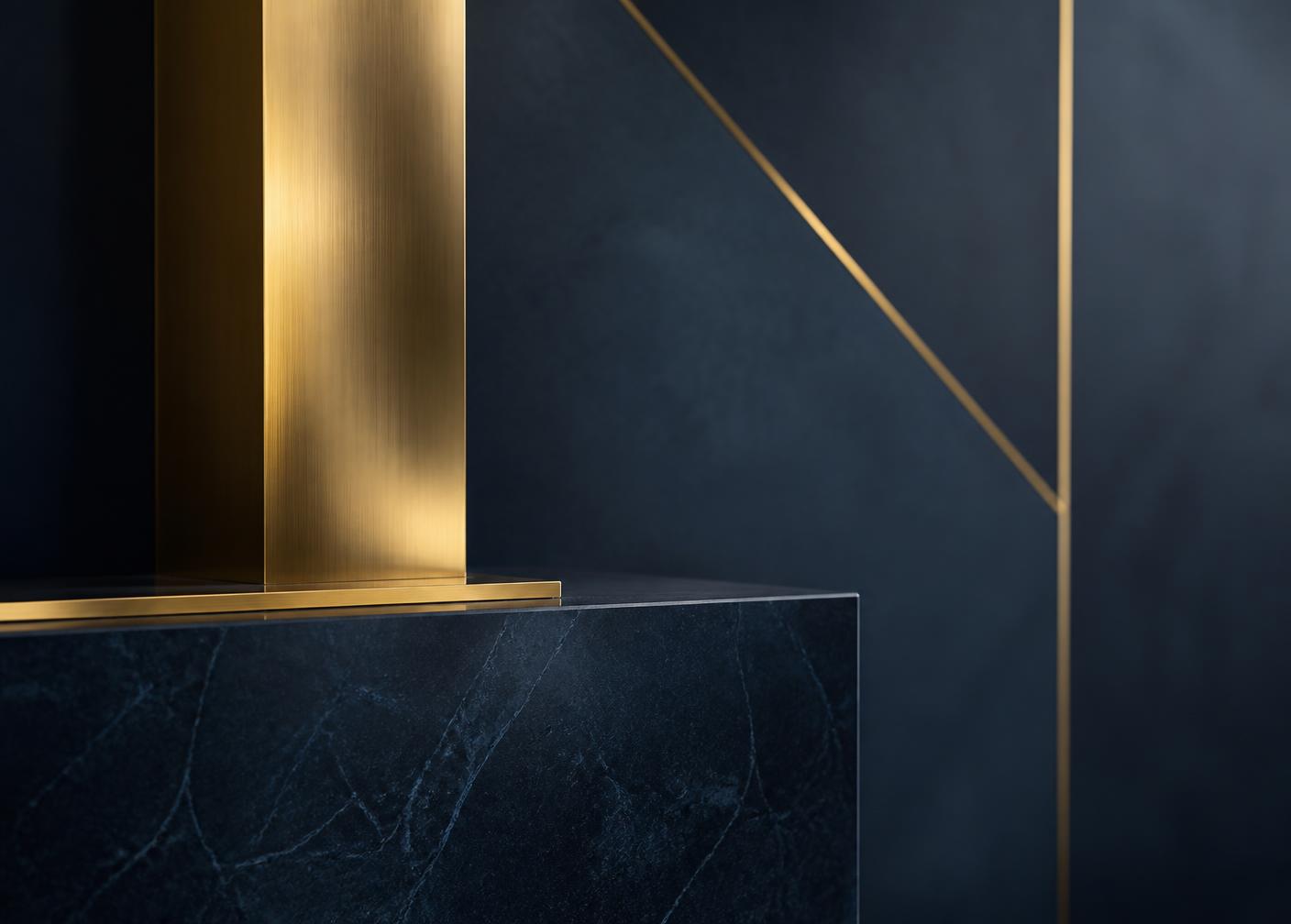 Brass and dark stone architectural detail